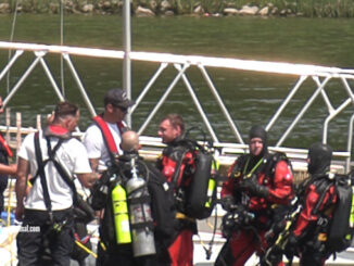 Divers safe out of the water immediately after recovering body from Lake Arlington on Friday, August 4, 2023.
